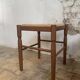 Pair of 20th century wooden stools with straw seats