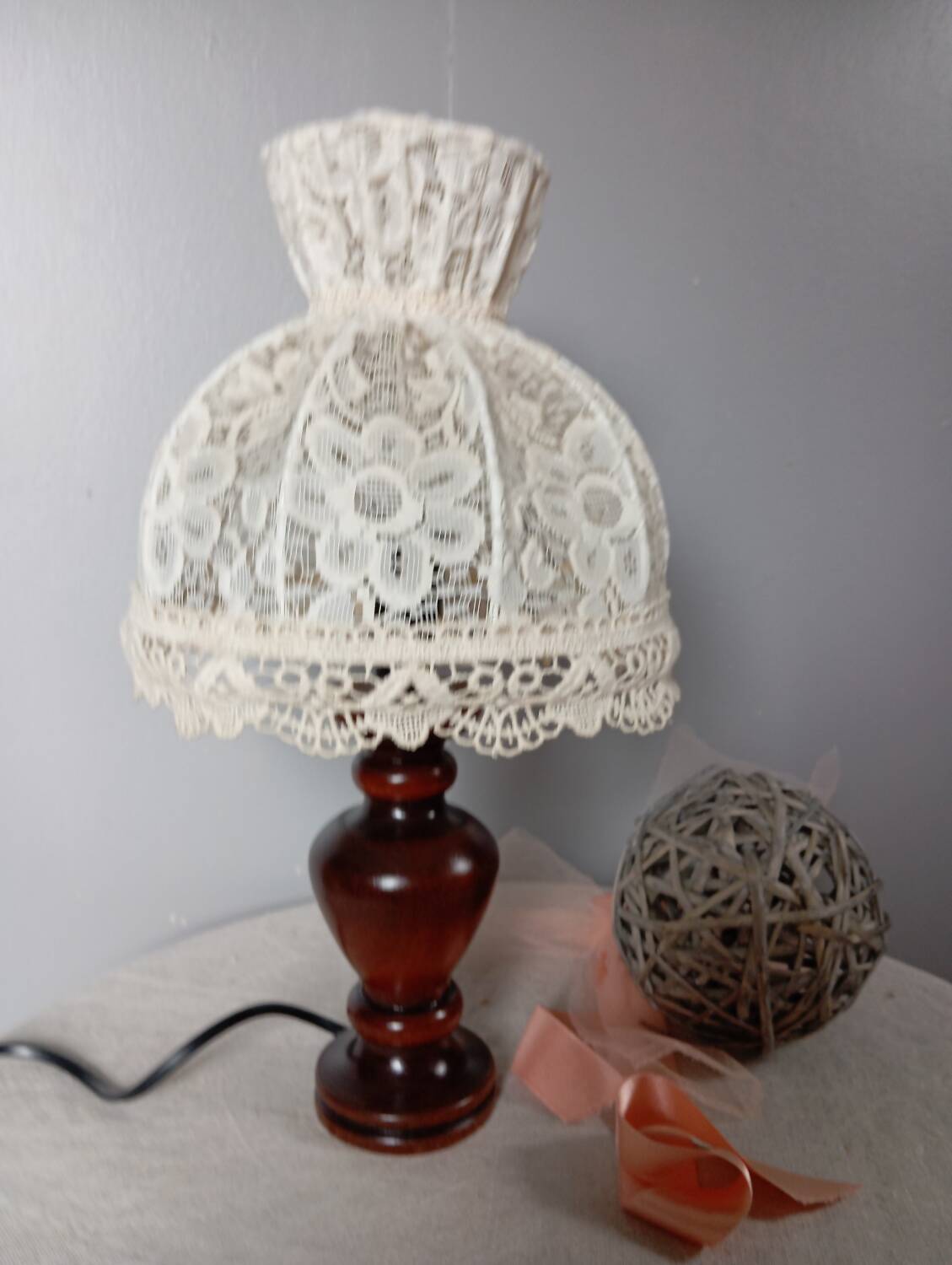 Table lamp with romantic wood and lace ambiance, retro chic