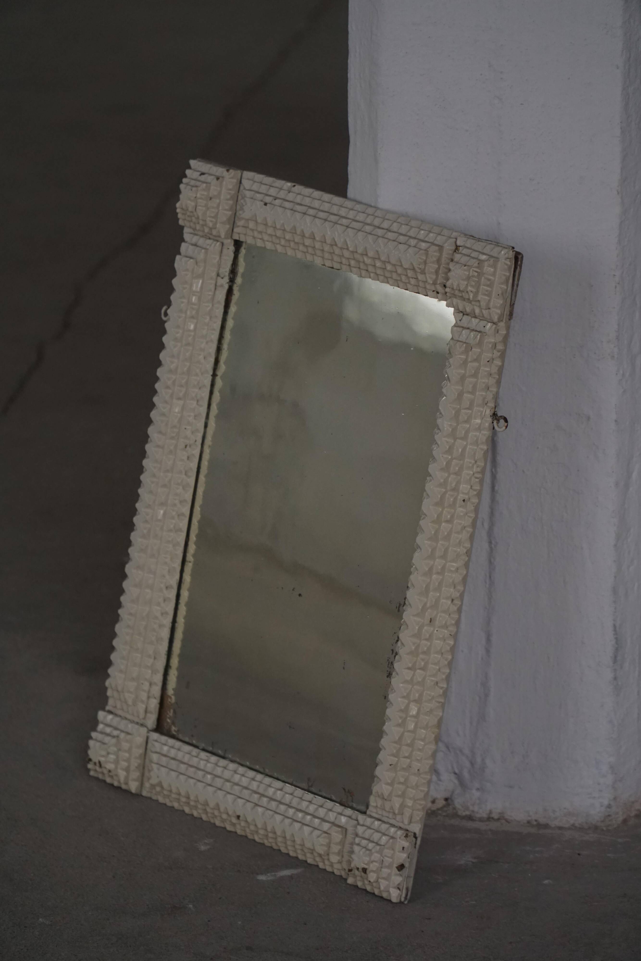 Wall mirror in tramp art style, hand-carved with a painted white frame, early 1900s.