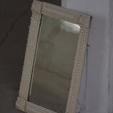 Wall mirror in tramp art style, hand-carved with a painted white frame, early 1900s.