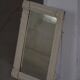 Wall mirror in tramp art style, hand-carved with a painted white frame, early 1900s.