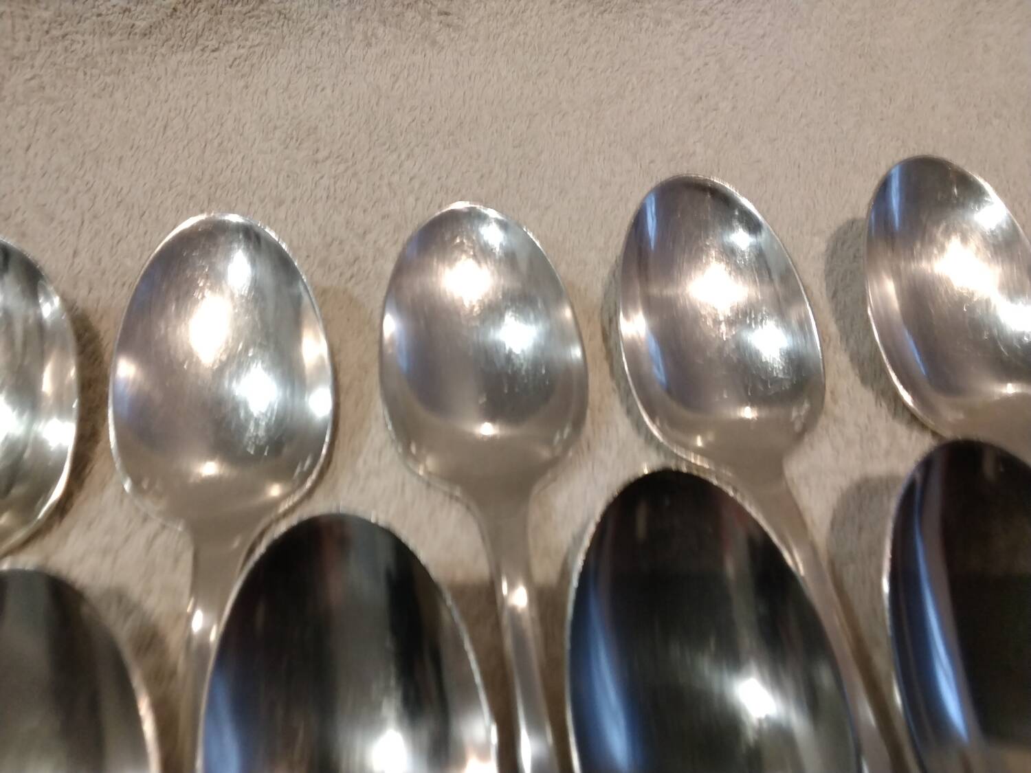 11 silver-plated dessert spoons by Christofle, Cluny pattern, striped