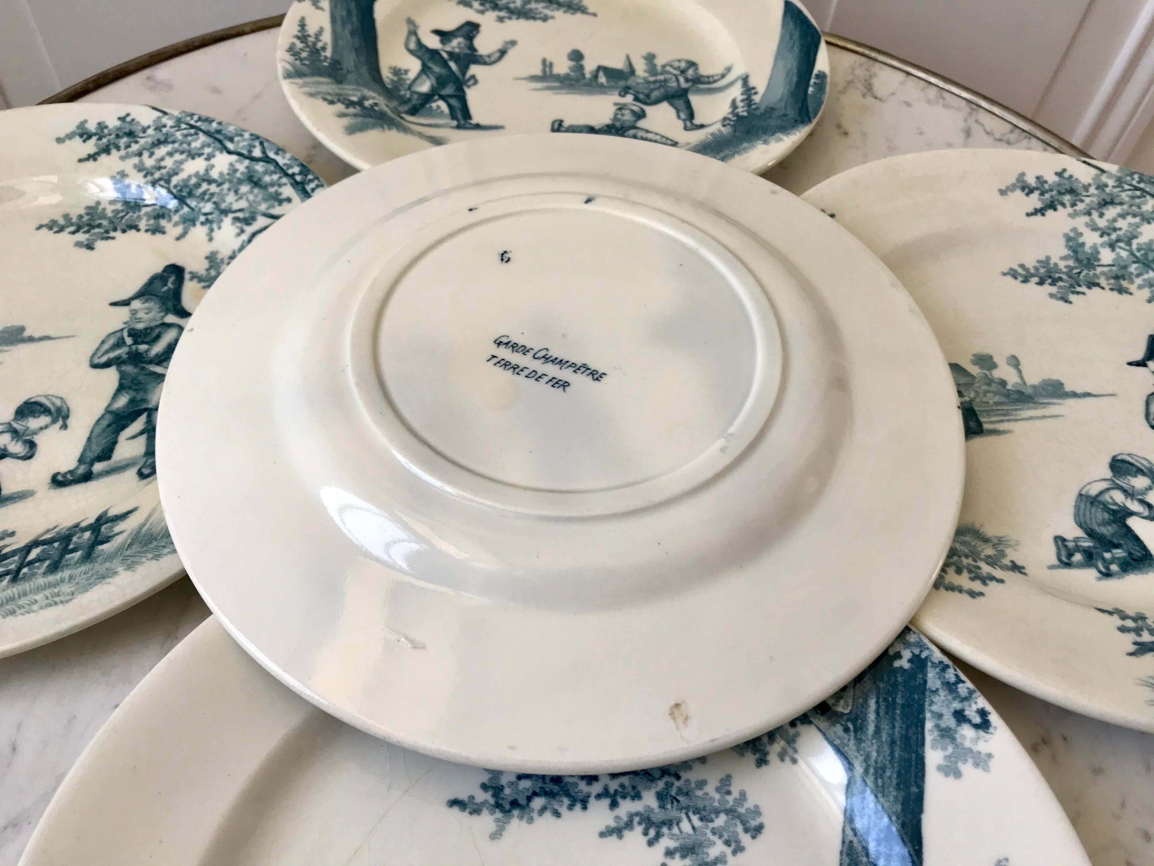 Set of 5 flat plates Iron Earth model "Garde-Champêtre" late nineteenth