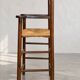 High chair made of straw and wood