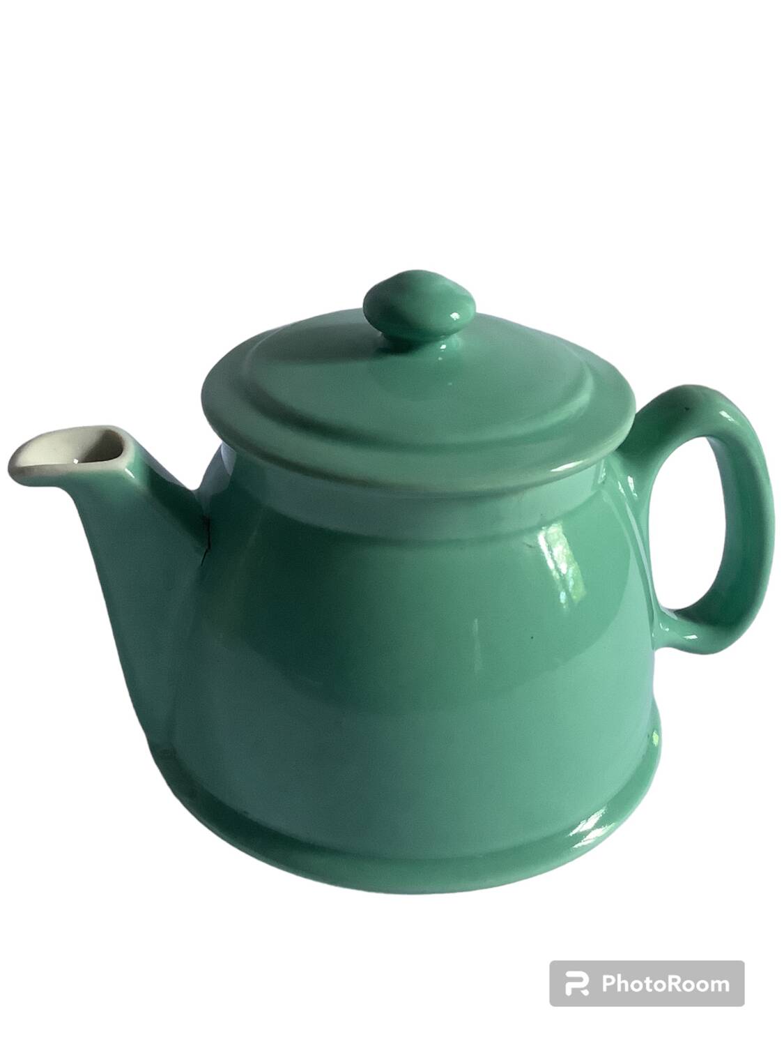 Old green ceramic teapot