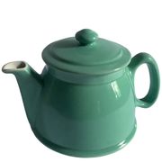 Old green ceramic teapot