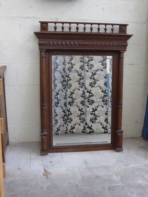 Large mirror beveled Henri II style varnished and carved wooden 128 x 92 cm
