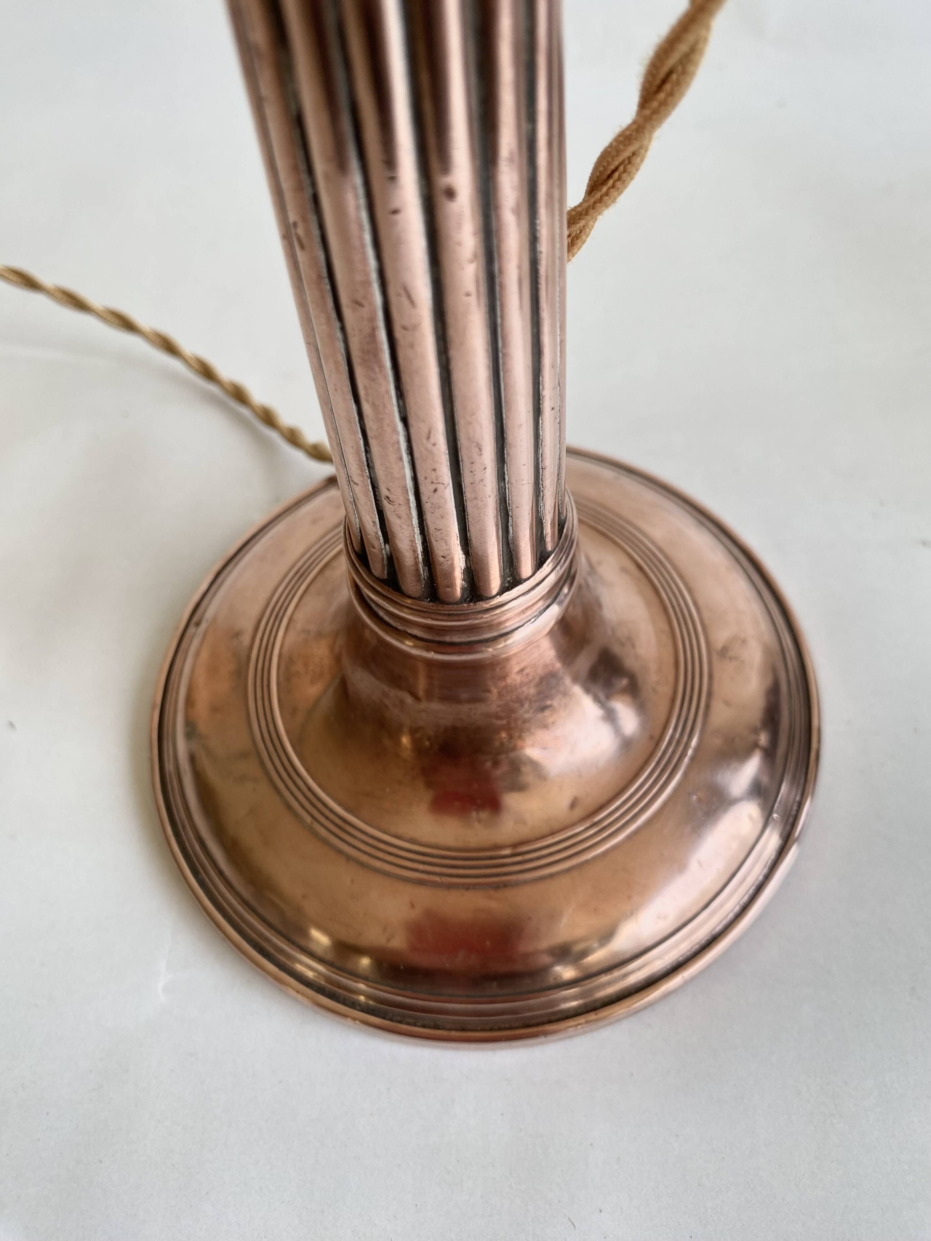 Copper lamp, fabric cable, sewn lampshade and leather.
