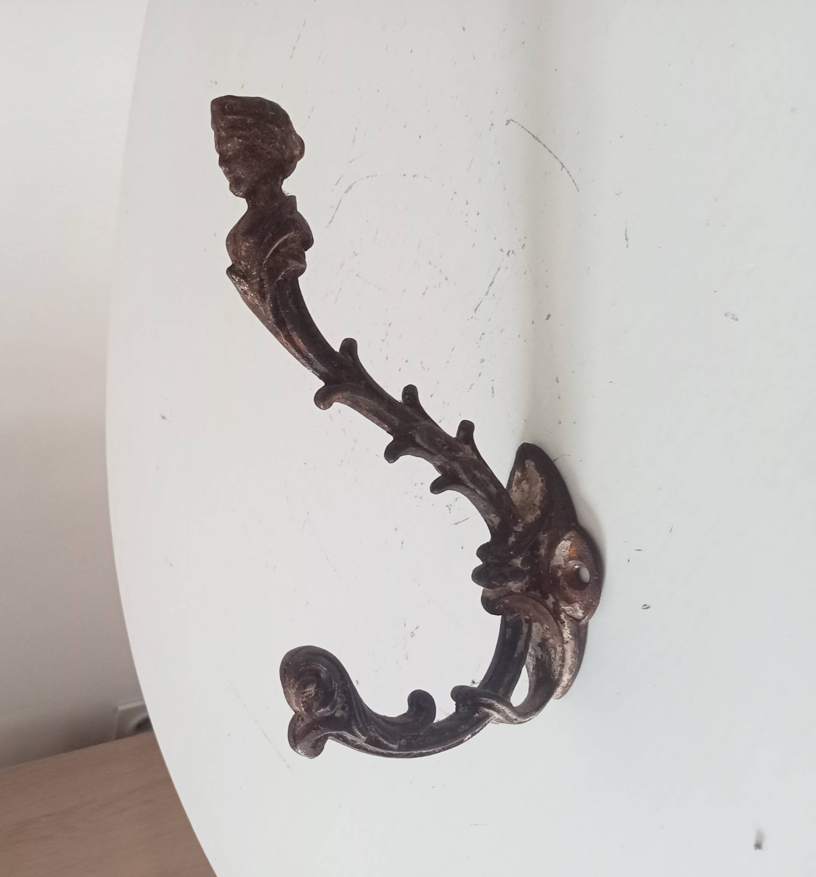 Antique wall coat hook from the 19th century in Victorian cast iron style.