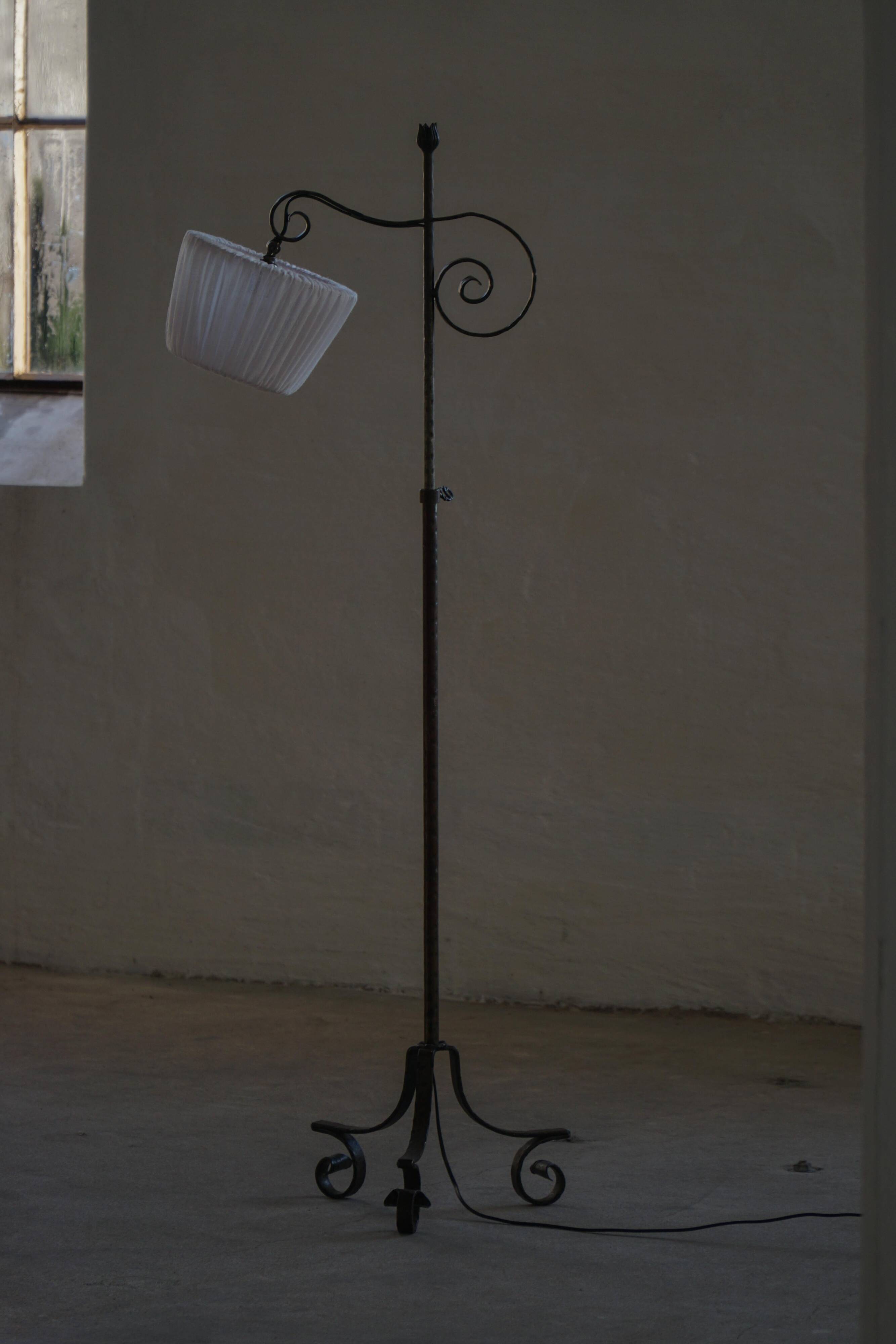 20th-century wrought iron floor lamp with swirling detail, Danish Art Deco.