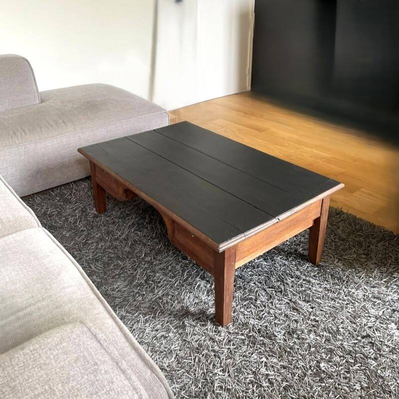 Wooden coffee table with black top