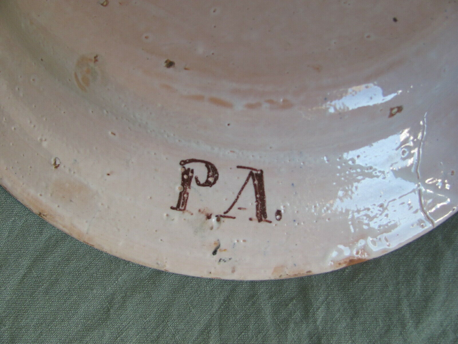 Faience dish decorated with yellow bird on a blue background