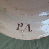 Faience dish decorated with yellow bird on a blue background