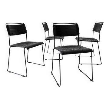 Vintage 1980s dining chairs, set of 4, postmodern design, black metal and plastic, checkered texture, minimal Italian design, retro interior.