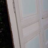 Pair of cupboard doors and old woodwork frame