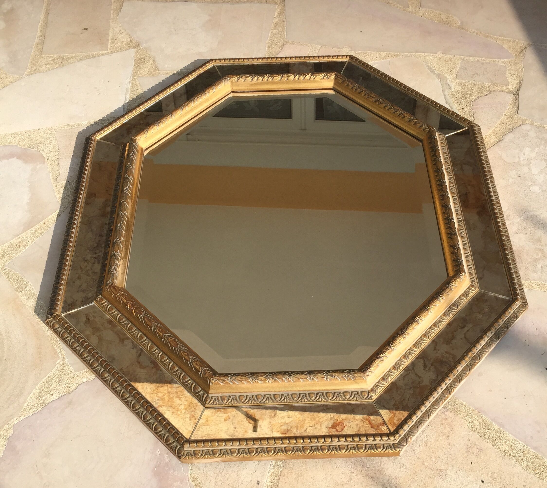 Antique mirror in gilded wood with beveled octagonal shape 72 x 63 cm