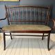 Thonet-branded bistro-style bench in turned wood, velvet and caning