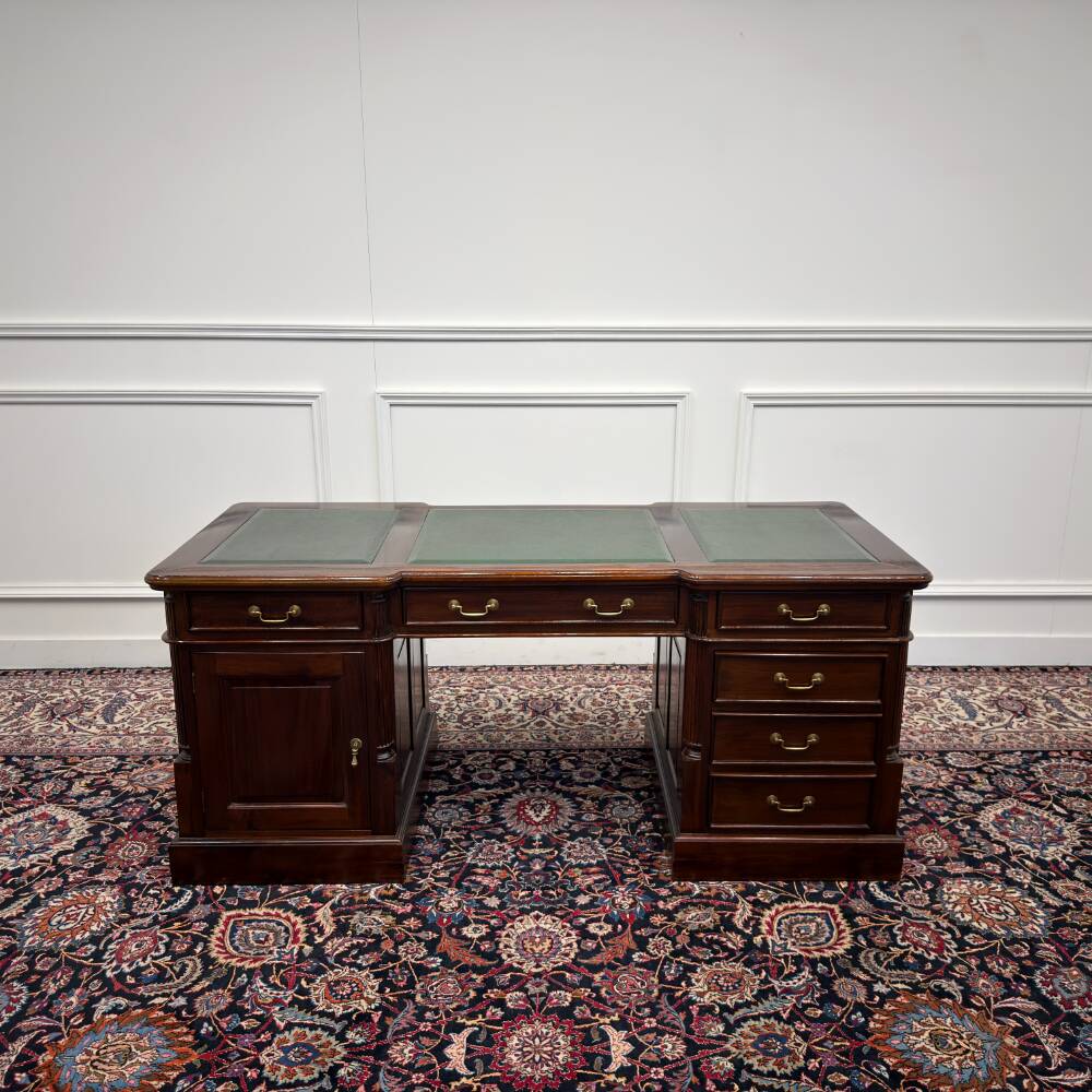 Classic English desk with green leather inlay.