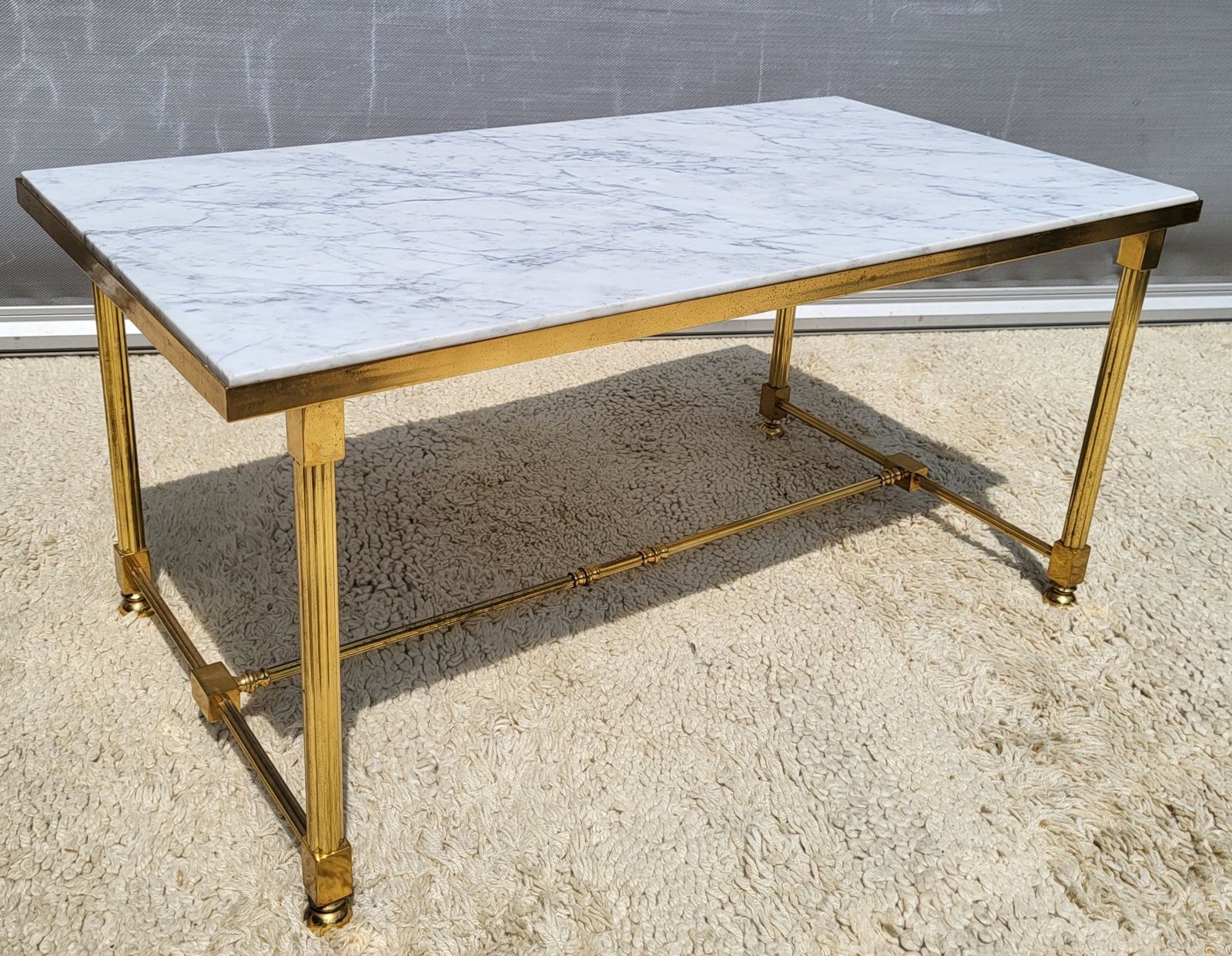 Hollywood Regency style coffee table • marble and brass