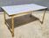 Hollywood Regency style coffee table • marble and brass