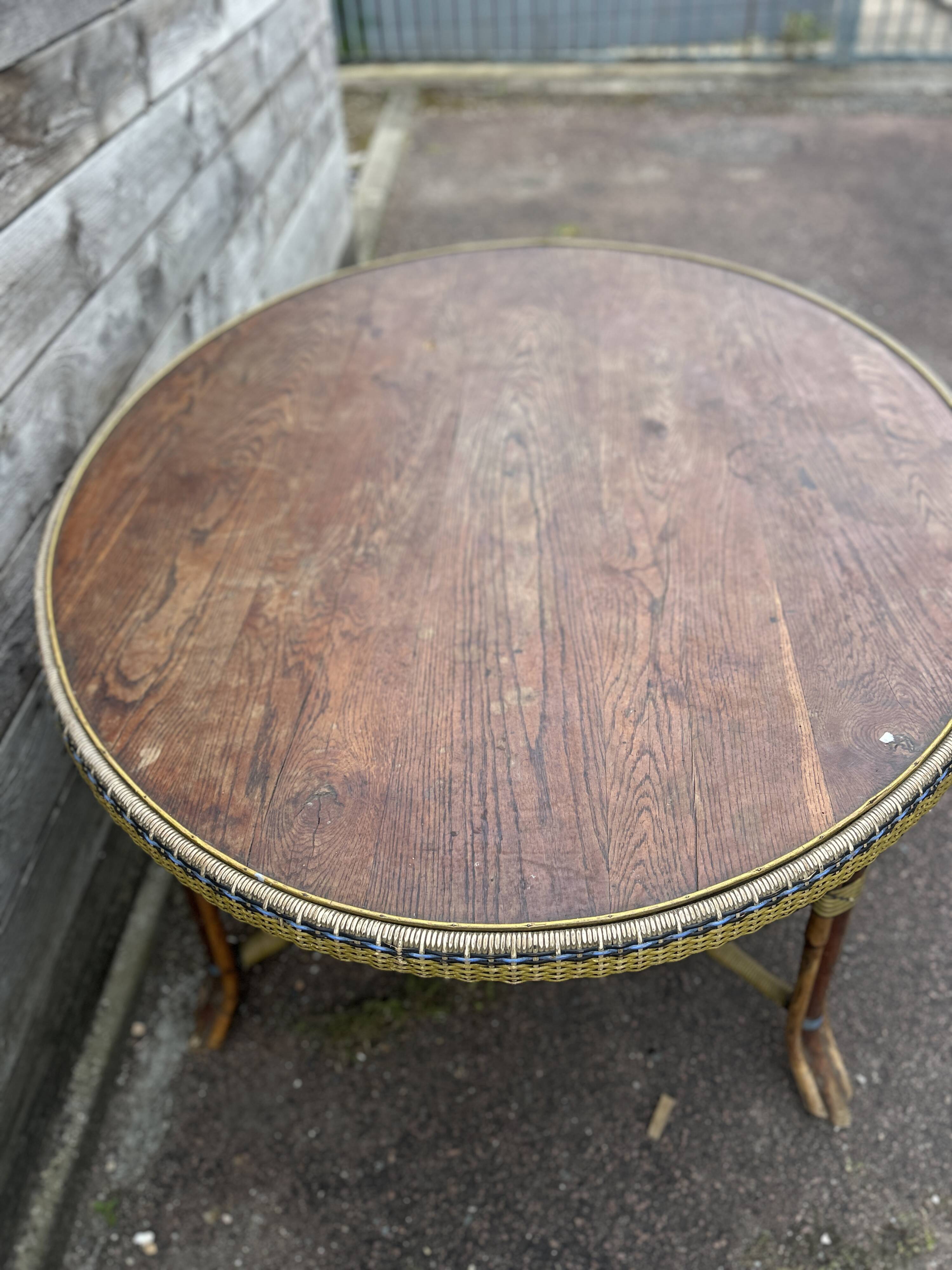 Table ovale en bois et rotin , début XX Siècle
