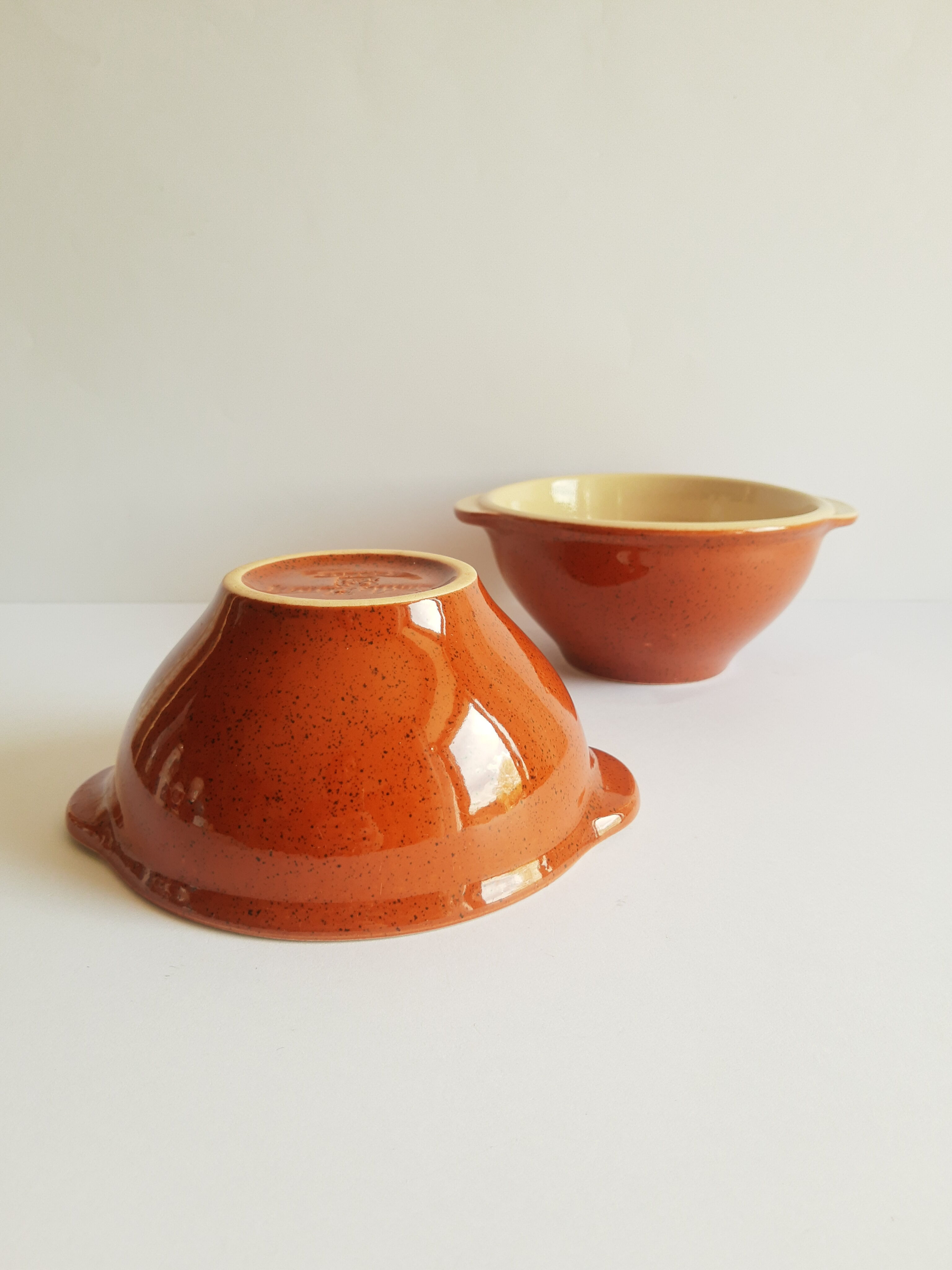 Duo of vintage Emile Henry cognac ear bowls