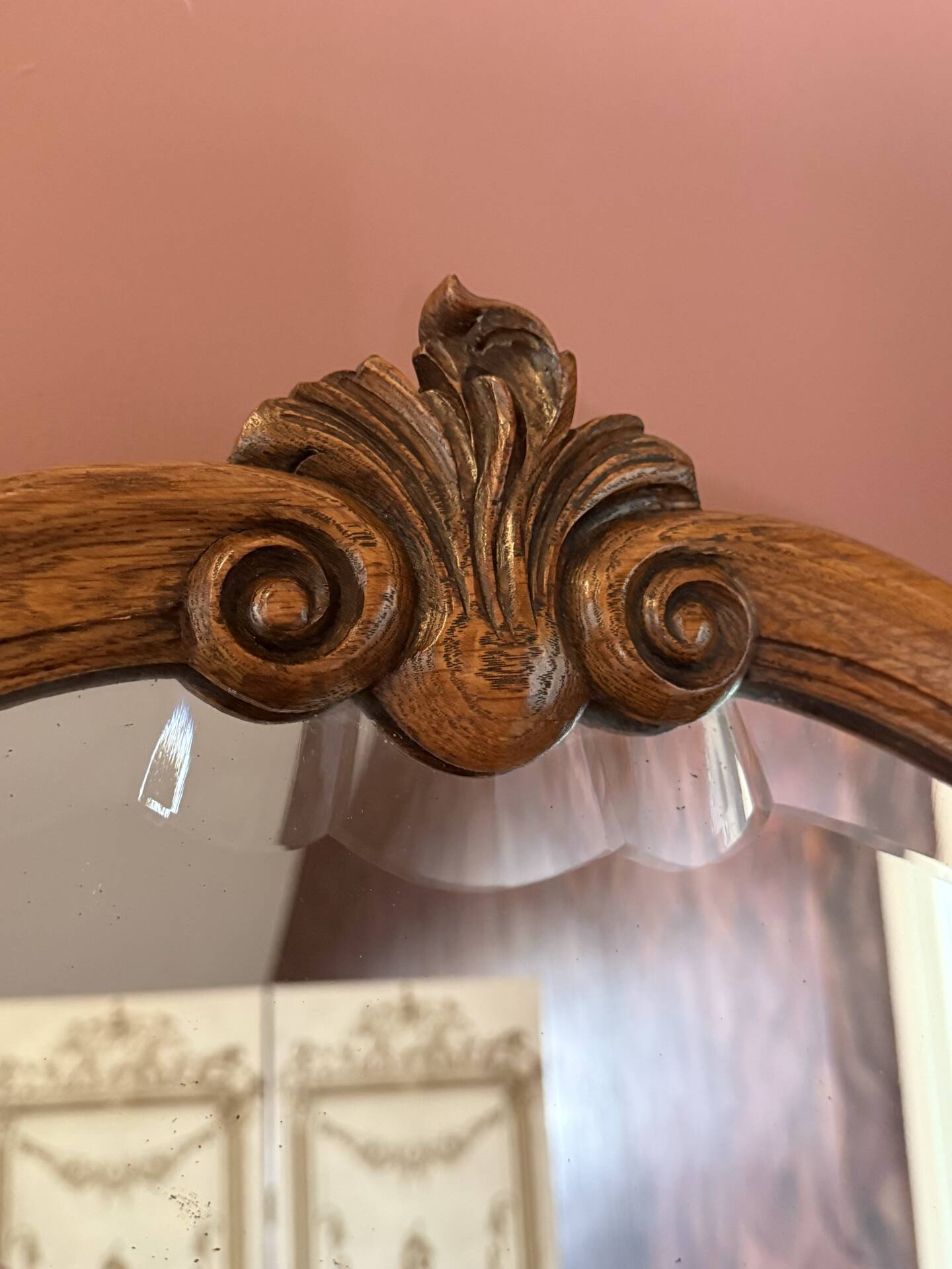 Antique bevelled mirror, oak frame