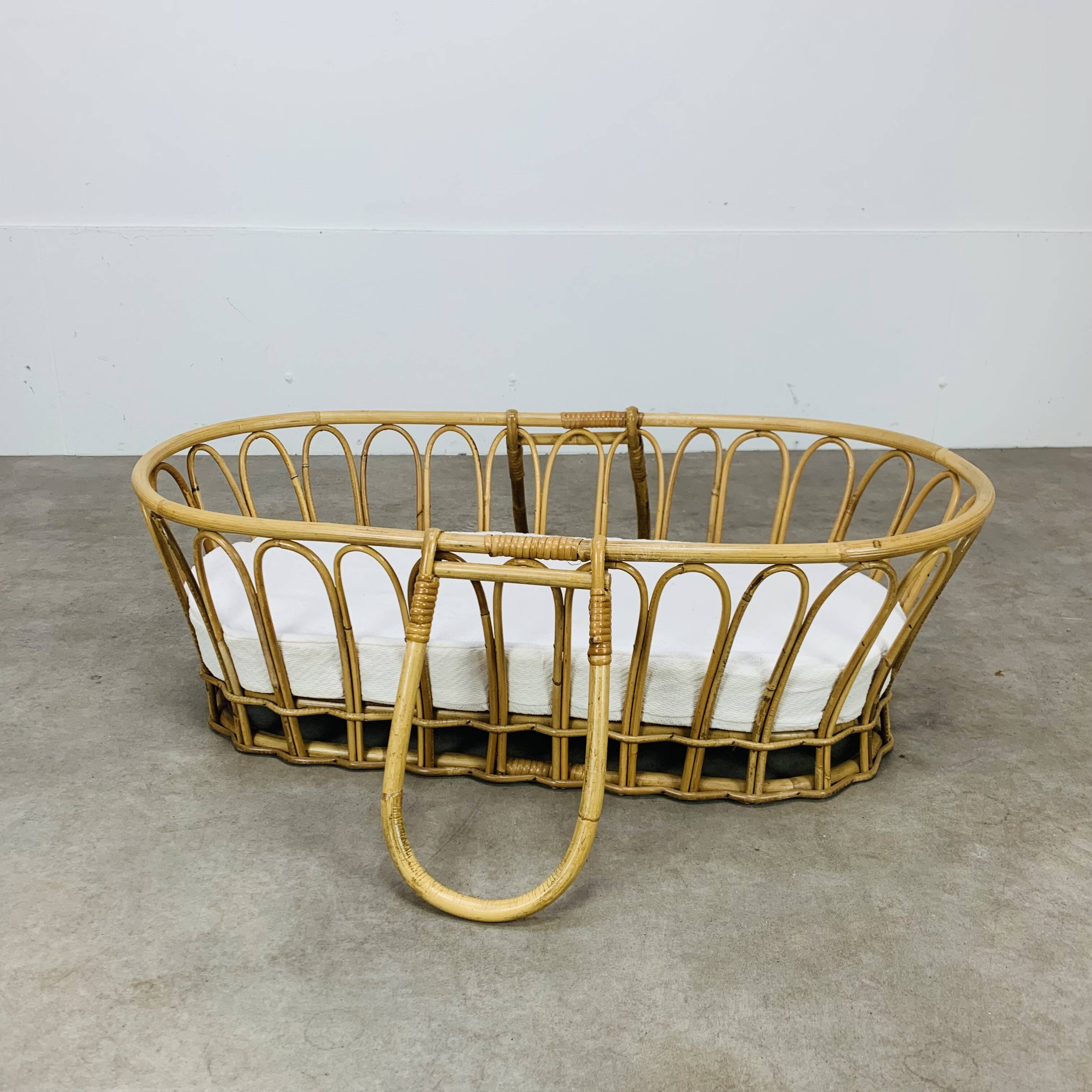 Vintage rattan baby bassinet