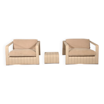 Paola Lenti lounge chairs and table frame your comfort.