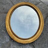 Antique gilded oval mirror