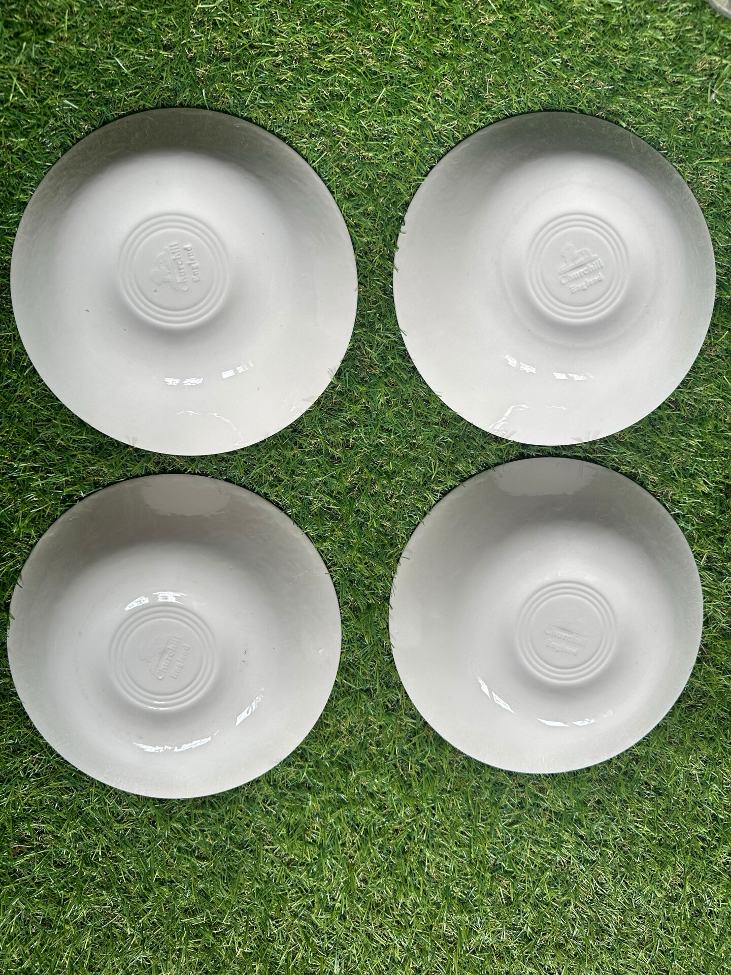 Set of 4 English deep plates by Churchill.