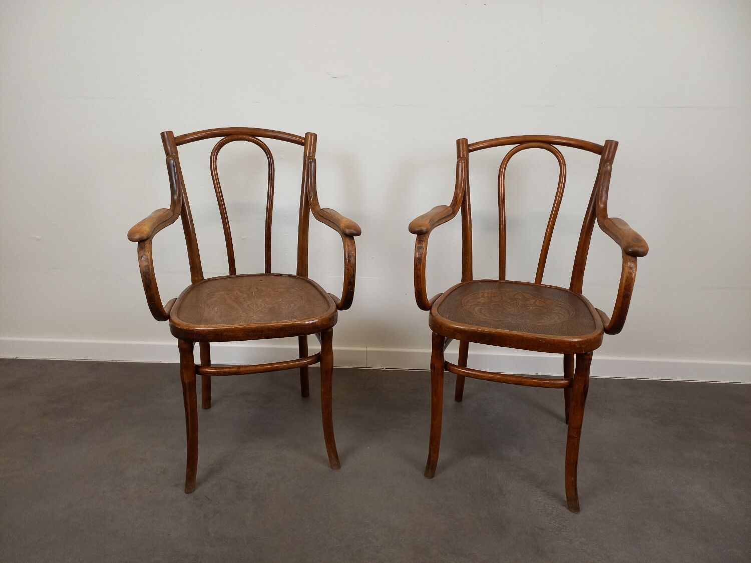 Pair of curved wooden bistro armchairs