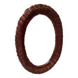 Vintage woven wicker oval mirror