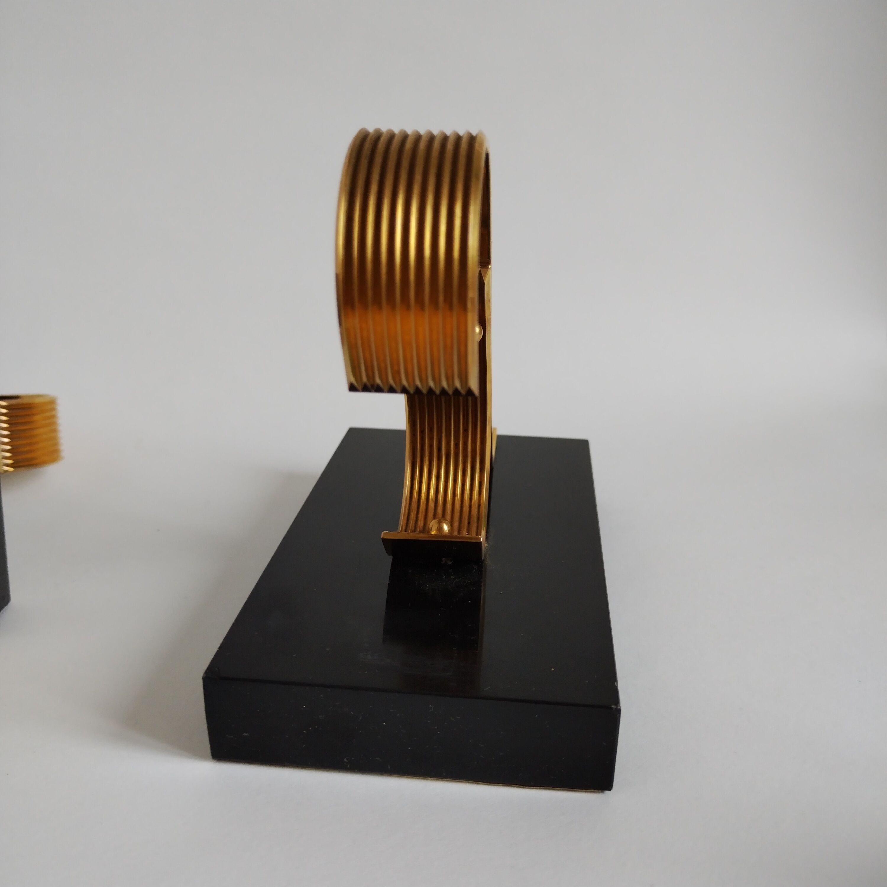 Pair of vintage Art Deco style bookends in marble and gold-plated metal