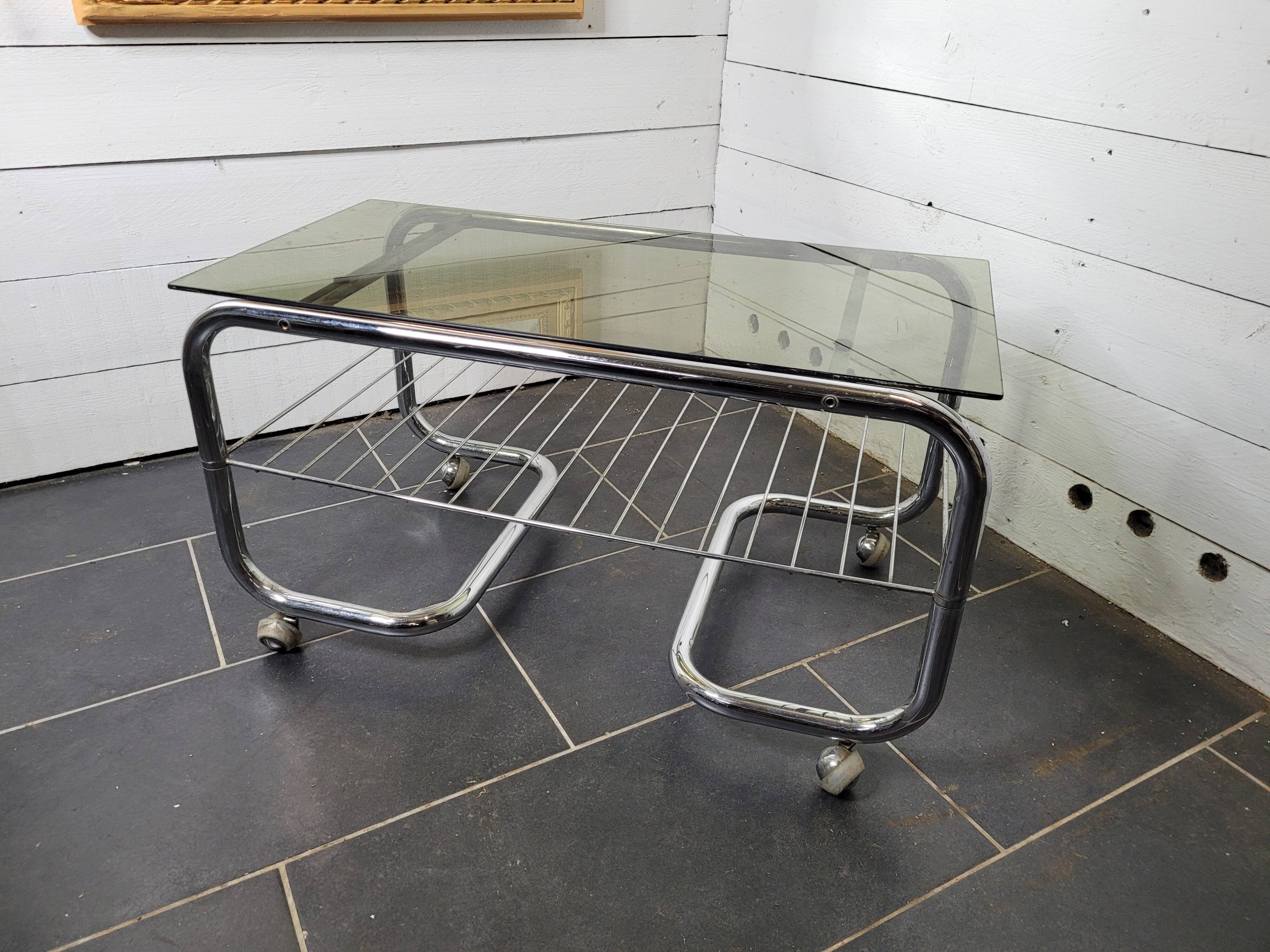 Coffee table with chrome base and smoked glass from the 70s