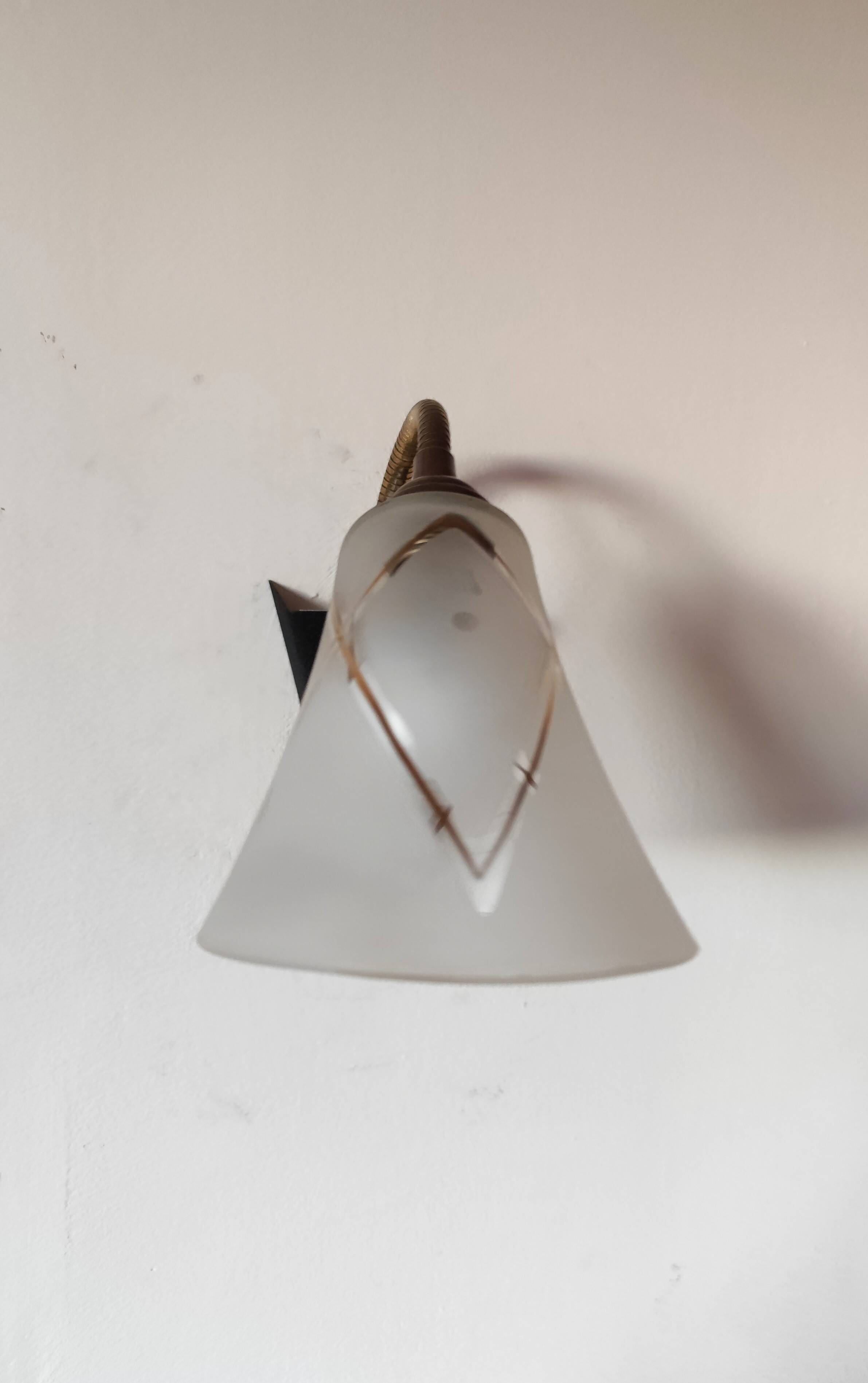 1950s wall lamp, metal, flexible brass stem and opaque shade.