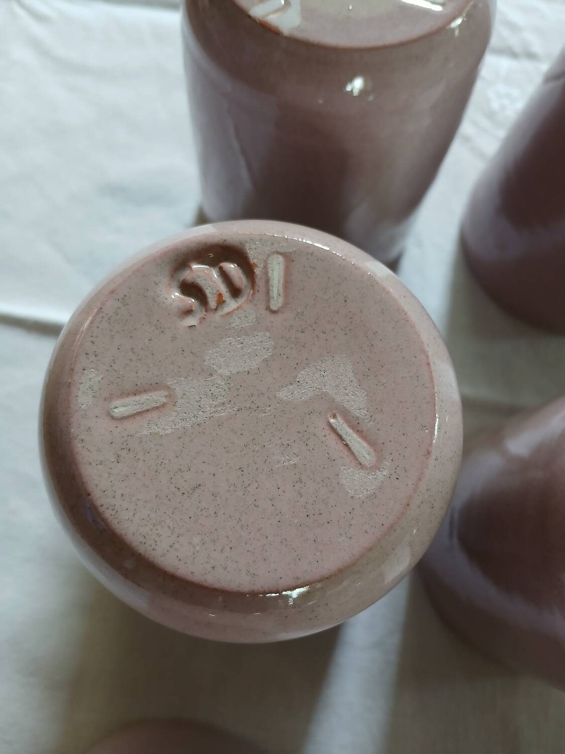 8 signed enamelled ceramic mugs