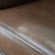Brown cowhide leather Chesterfield club armchair in English style