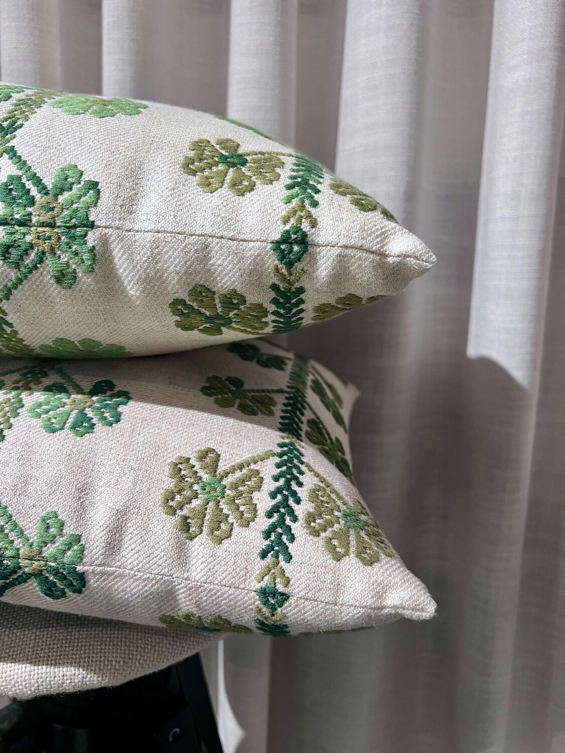 Custom cushions with green clover patterns.