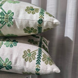 Custom cushions with green clover patterns.