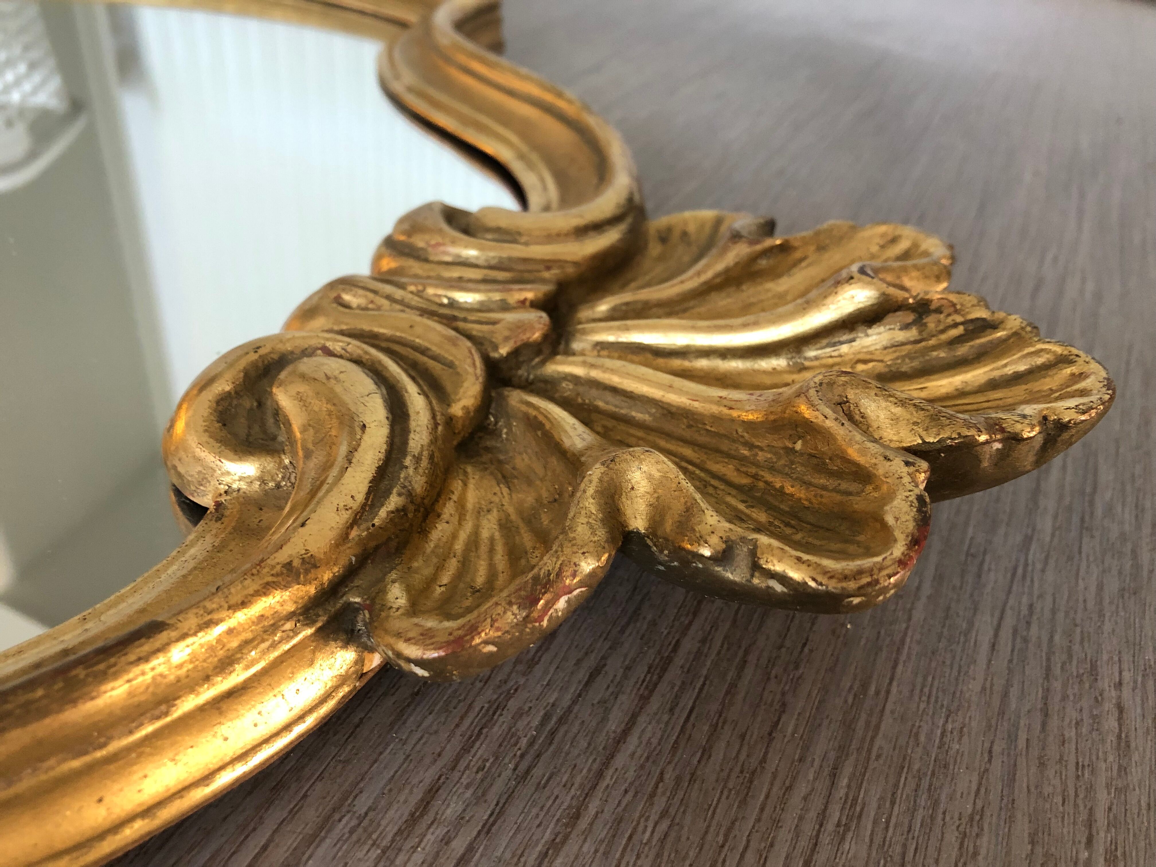 Golden baroque mirror with its 54x86cm tablet