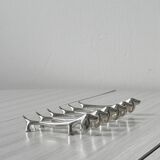 Metal dachshund dog knife holder.