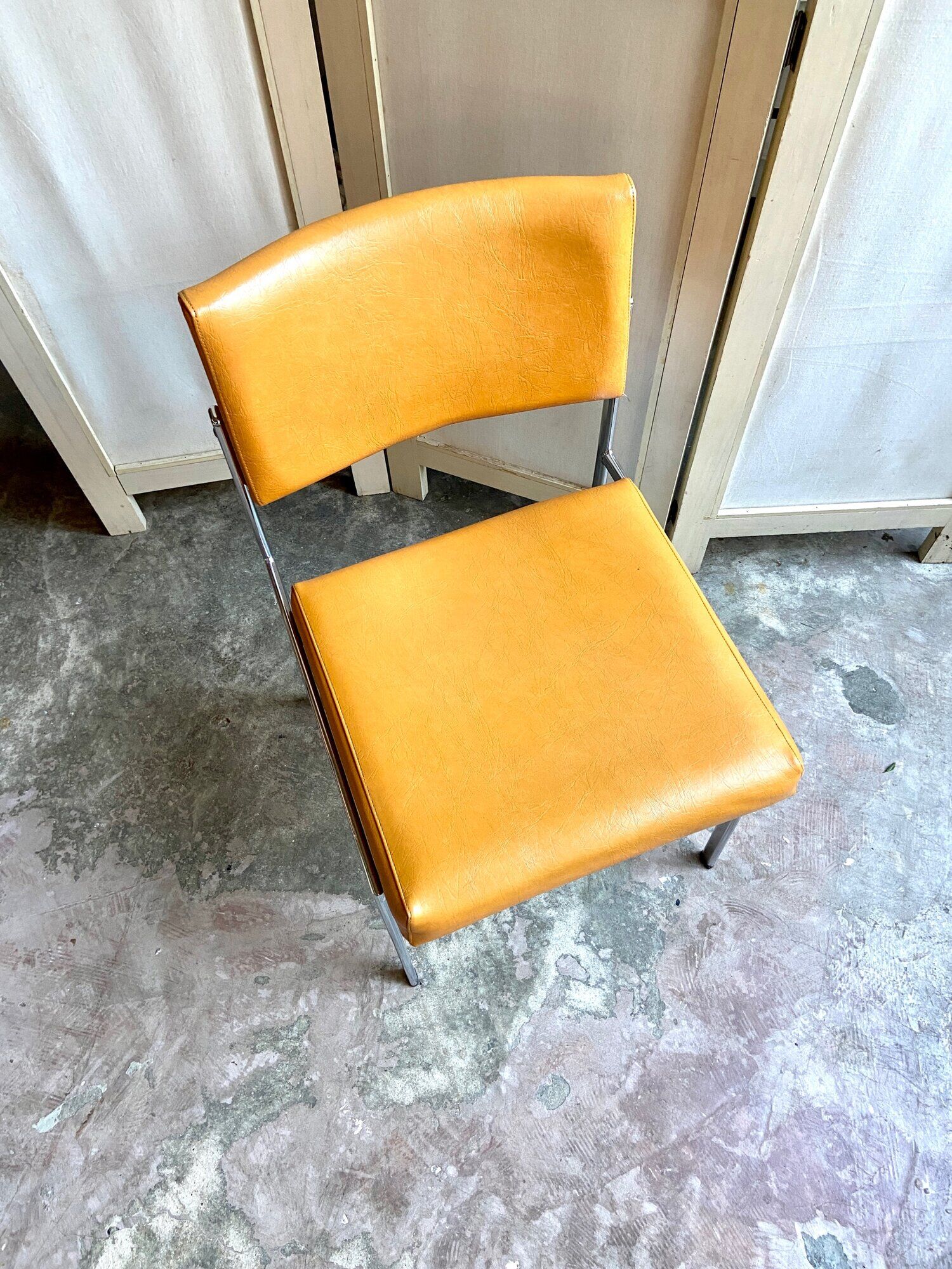 Chair in chromed metal and ochre skaï 1970s