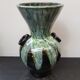 Old black enamelled ceramic Gaubier vase with green white vintage drips