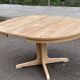 Scandinavian Baumann round extendable dining table with central leg, 115cm.