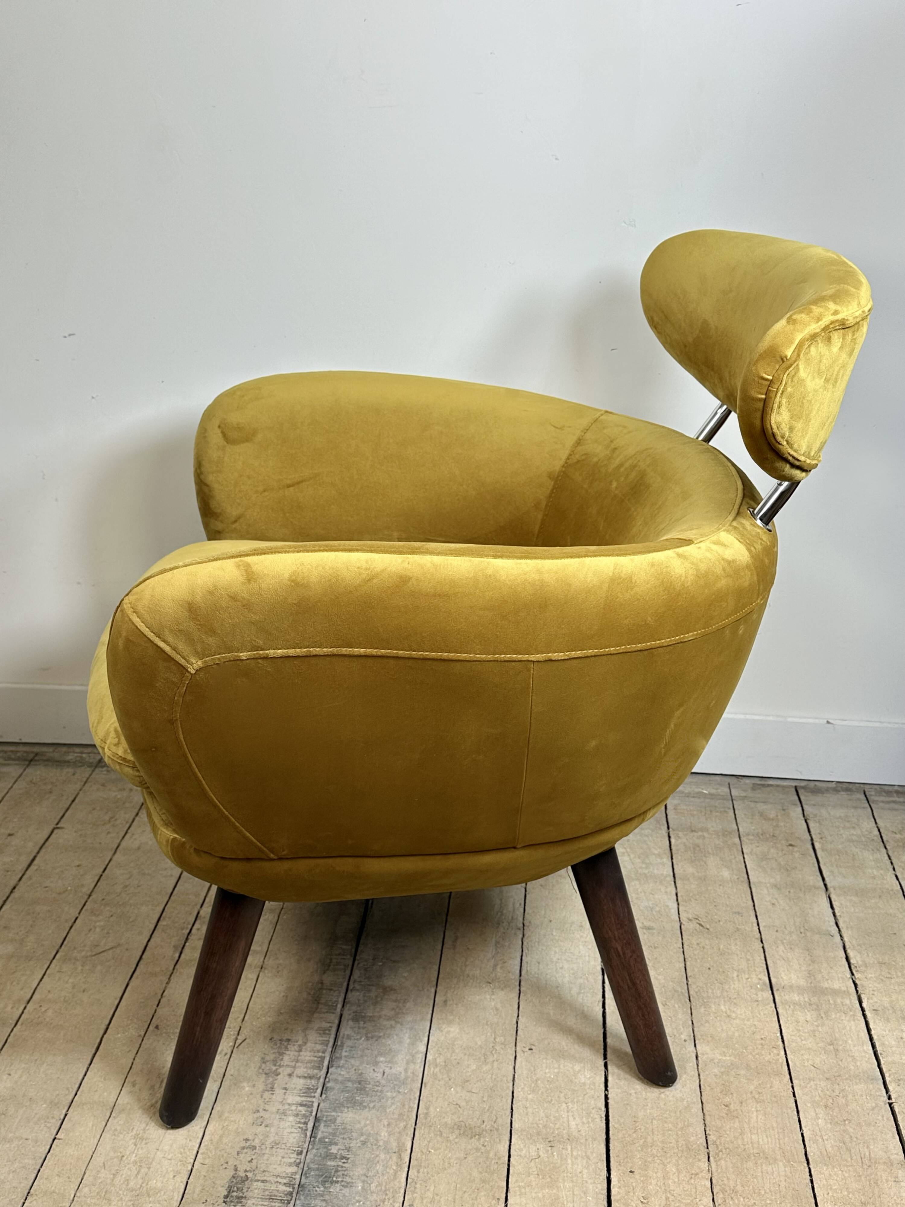 Mustard yellow velvet armchair from the 2010s.