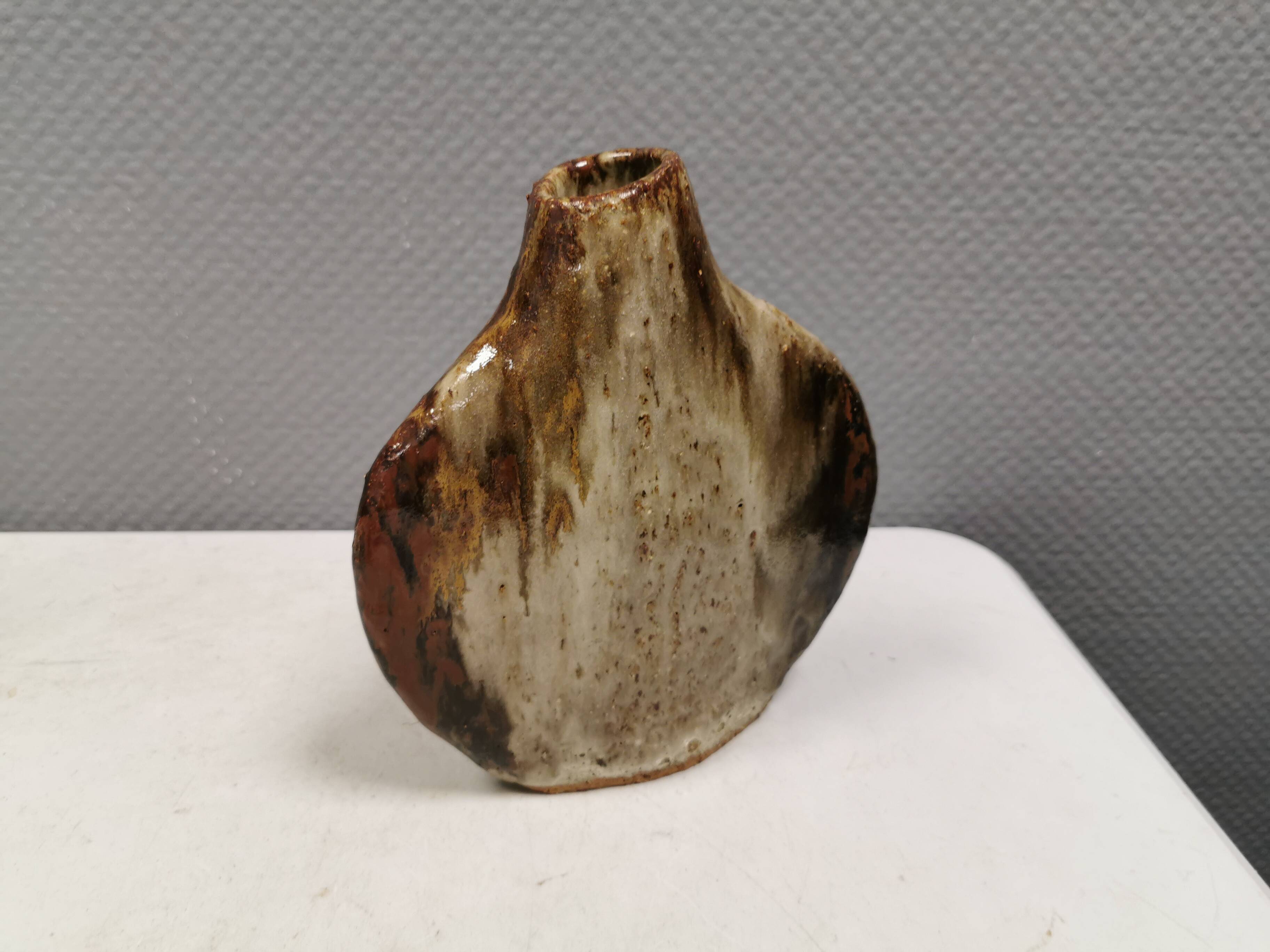 A beautiful Brutalist vase in lovely earth tones. Danish, from the 1980s.
