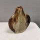 A beautiful Brutalist vase in lovely earth tones. Danish, from the 1980s.