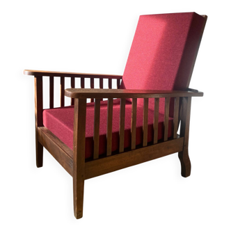 Morris chair with wooden frame and burgundy cushions.