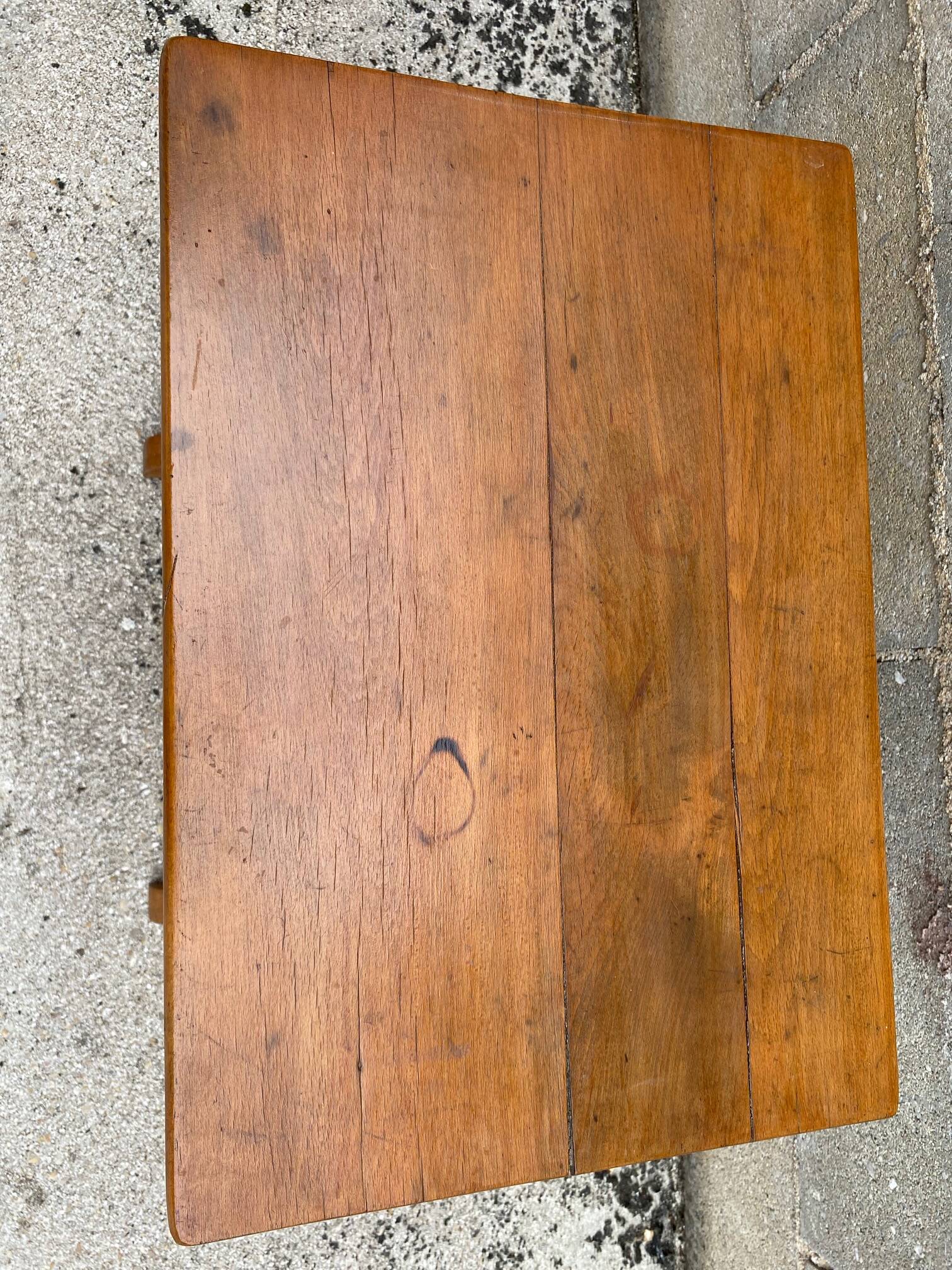 Small side table or bistro serving table with curved wood.